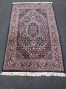 A Tabriz design rug, 194cm by 119cm. CONDITION REPORT: In good condition. Hand woven.