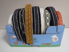 A box of nine spools of Silver Cross pram trim