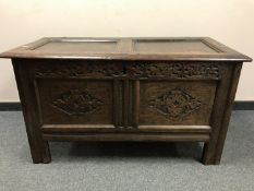 A George III panelled oak coffer,