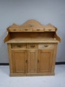An antique pine buffet backed sideboard