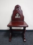 A stained pitch pine church chair