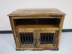 A mango wood entertainment stand