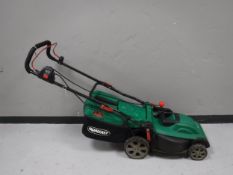 A Qualcast electric lawn mower with lead