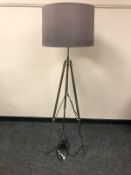 A contemporary rise and fall floor lamp