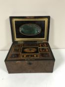 A Victorian inlaid walnut workbox with fine detailed interior