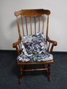 A stained beech rocking chair