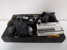 A box of assorted cameras and accessories