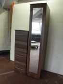 A mirrored storage cabinet together with matching six drawer chest