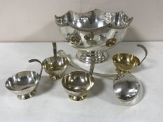 A silver plated punch bowl with ladle and cups CONDITION REPORT: Bowl 31cm in