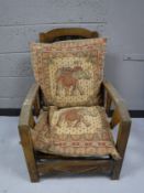 An early twentieth century oak adjustable armchair