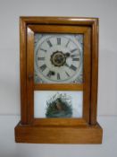 A pine cased American mantel clock.