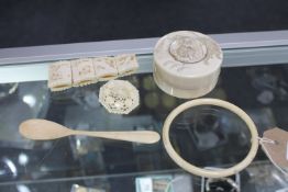 Five pieces of antique ivory - trinket box, spoon,