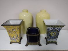 A pair of lidded glazed urns,