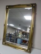 A gilt framed overmantel mirror