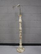 A marble topped twist column standard lamp
