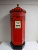 A wine cabinet in the form of British postbox