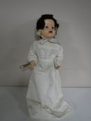 A mid 20th century doll