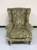 A Parker Knoll wing backed armchair