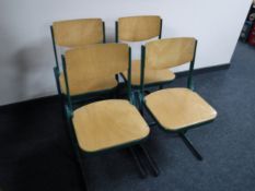 A set of four mid twentieth century metal framed beech chairs