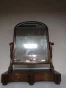 A Victorian mahogany dressing table mirror fitted with two drawers