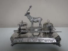 An early twentieth century plated desk stand surmounted with a stag