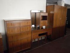 A six piece mid twentieth century walnut bedroom suite comprising of double door wardrobe,