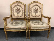 A pair of French gilt armchairs with tapestry upholstered seats
