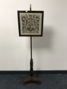 A Victorian rosewood pole screen