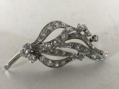 An 18ct white gold diamond spray brooch, 9.6g, approximately 2ct.
