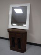 A contemporary hardwood corner stand together with a white painted framed mirror