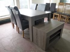 A contemporary dining table together with a set of four leather dining chairs and matching