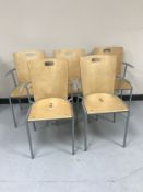 A set of five metal framed beech armchairs