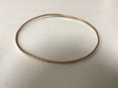A 14ct gold bangle CONDITION REPORT: 4.