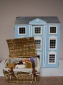 A Victorian style doll's house and a basket of assorted doll's house furniture