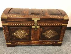 An Eastern style brass inlaid domed chest