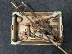 A box of a collection of African pipes