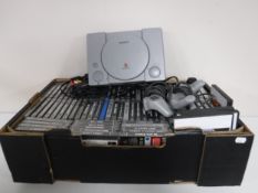 A box of Sony Playstation 1 with leads,