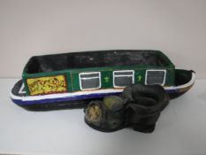 A concrete barge garden planter and a boot planter