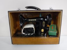 A mid 20th century cased Singer sewing machine.