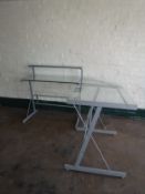 A contemporary metal and glass corner desk