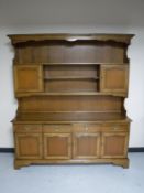 A Stag four door kitchen dresser in an oak finish