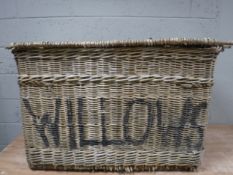 A large wicker laundry hamper