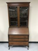 A late Victorian inlaid mahogany bureau bookcase