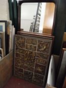 A mid twentieth century teak framed mirror together with a mahogany framed wall mirror and tiled