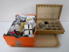 A tray of three boxes of a large quantity of costume and sterling silver jewellery