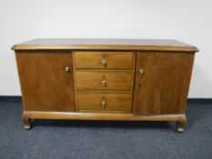 A continental oak sideboard fitted three drawers