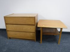 A mid twentieth century teak three drawer chest together with two tier coffee table