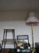 A brass standard lamp with shade together with a nest of two tables and box of framed needlework,