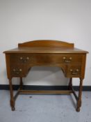 An Edwardian satin walnut dressing table