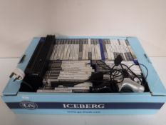 A box of Sony Playstation 2 with leads,